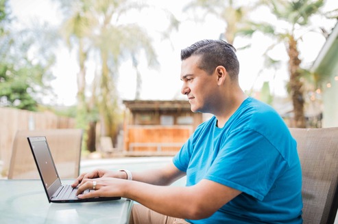 Student sitting at a laptop